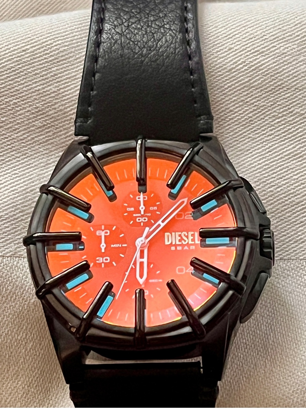 Diesel Black Cage Watch with Orange Dial and Blue Accents